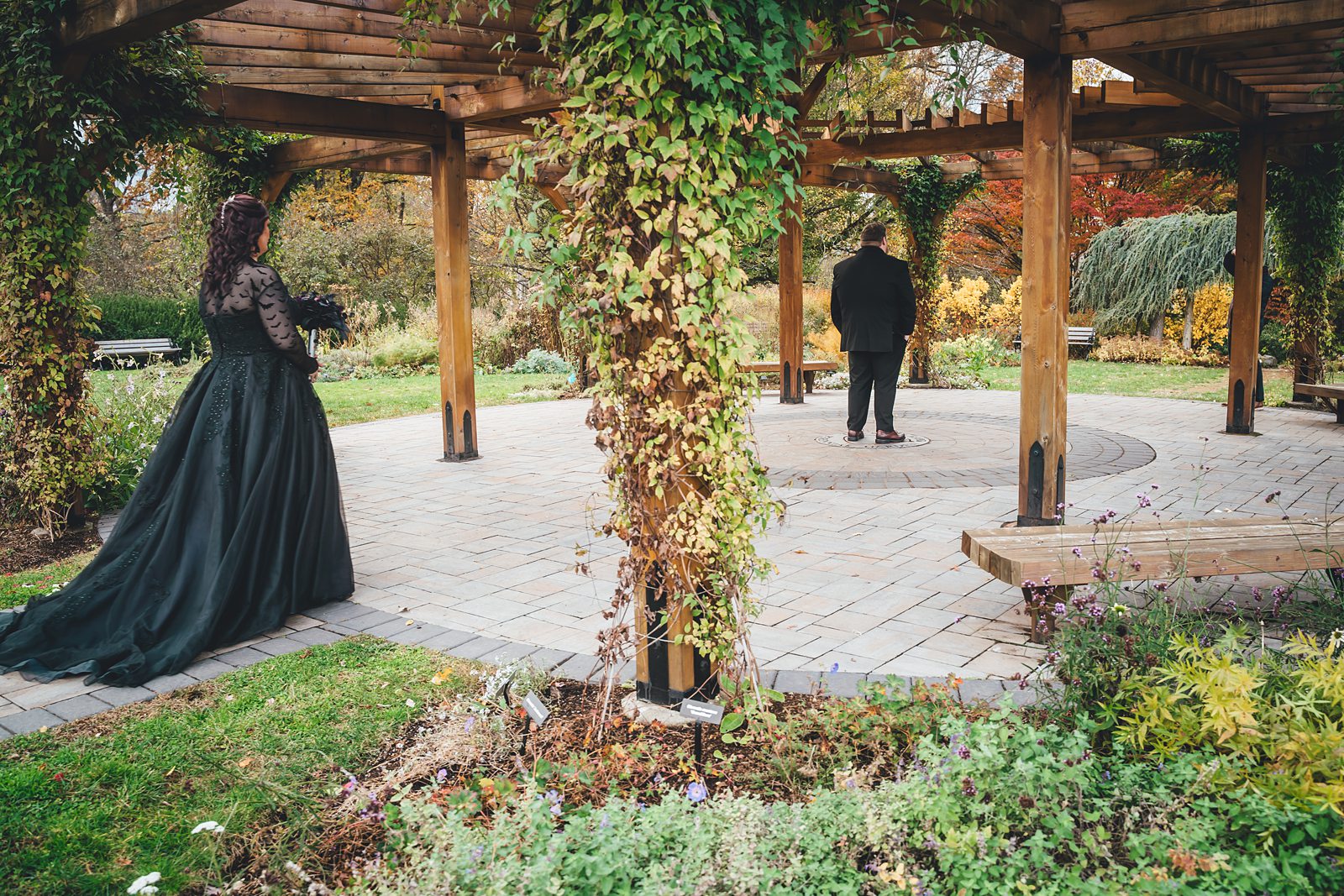 First look at The Pond House pergola - bride approaching groom
