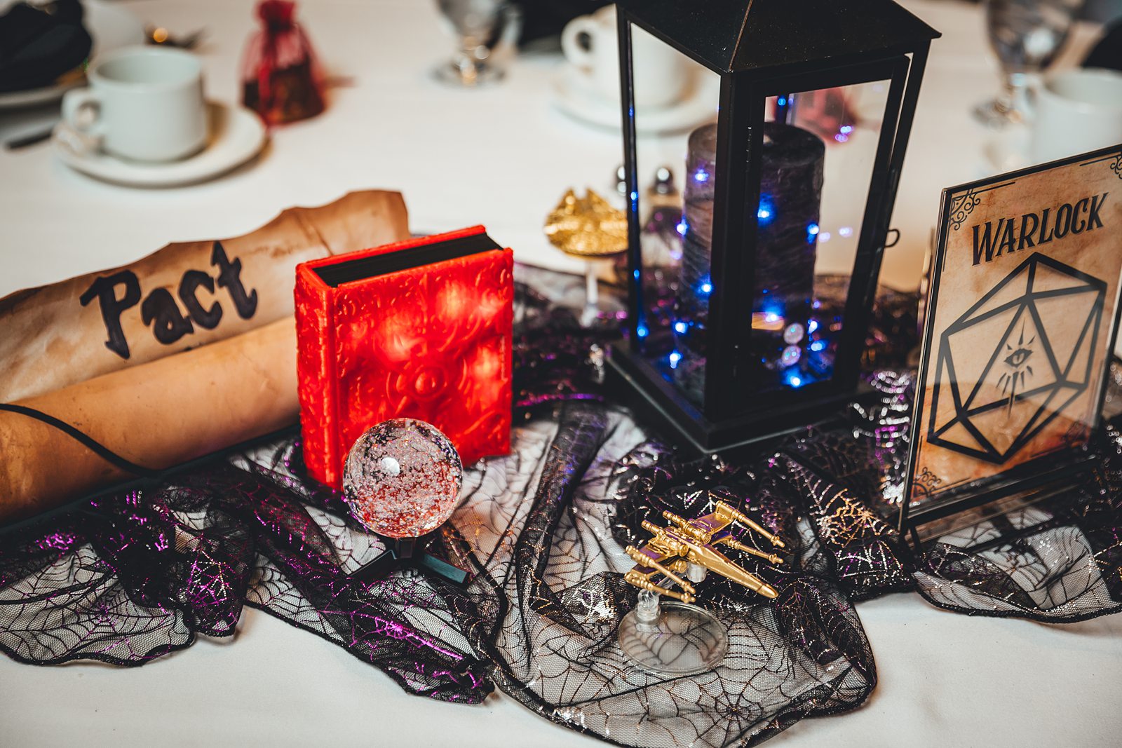 Warlock table centerpiece with crystal ball and Pact scroll