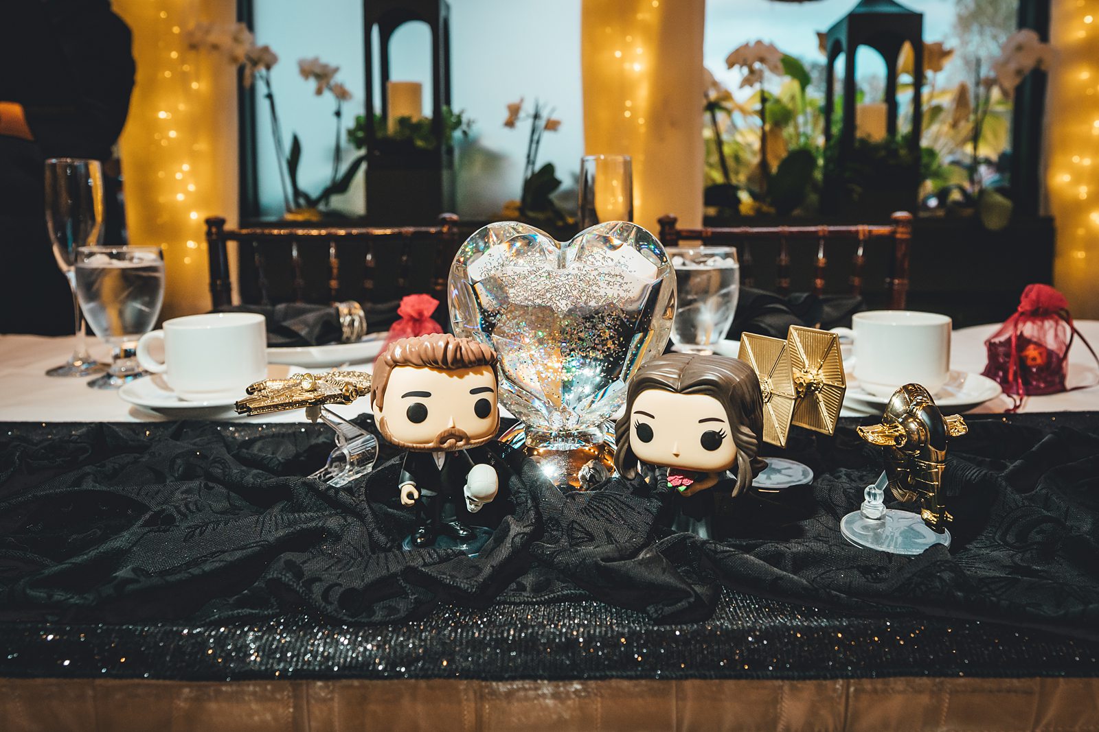 Custom Funko Pop couple figures with glitter heart at sweetheart table
