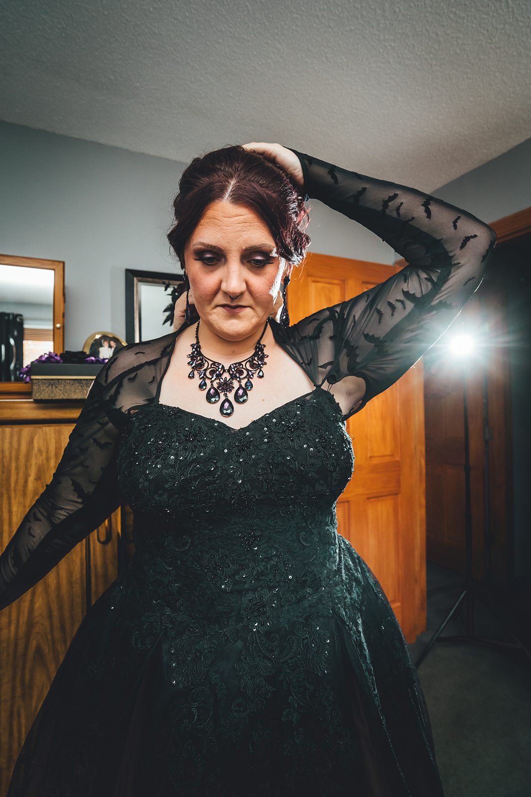 Jaqulyn in full black wedding dress with bat lace sleeves